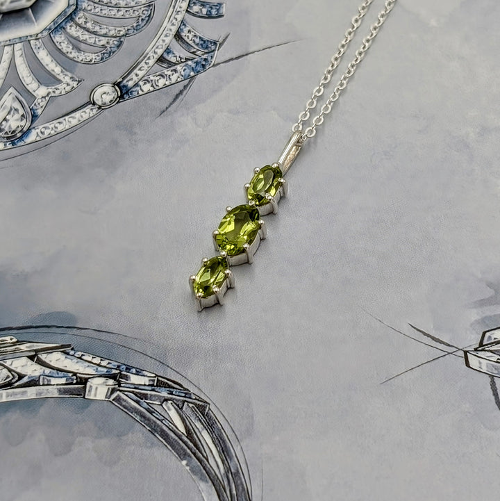 Faceted Oval 3-Stone Peridot Necklace Set in Sterling Silver