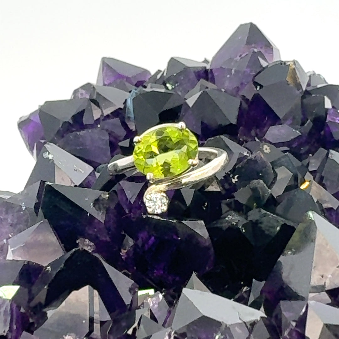 Oval Cut Peridot and Cubic Zirconia Ring in Sterling Silver