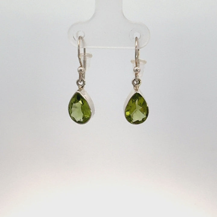 Pear Cut Peridot Dangle Earrings in Sterling Silver