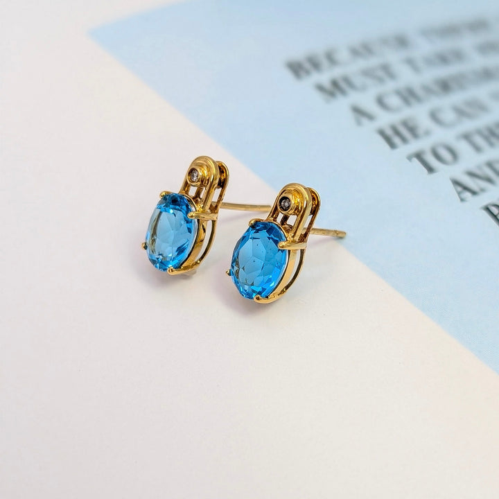 Blue Topaz & Diamond Stud Earrings in 14K Yellow Gold