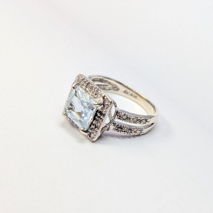 Blue Topaz & Diamond Halo Ring in 14K White Gold