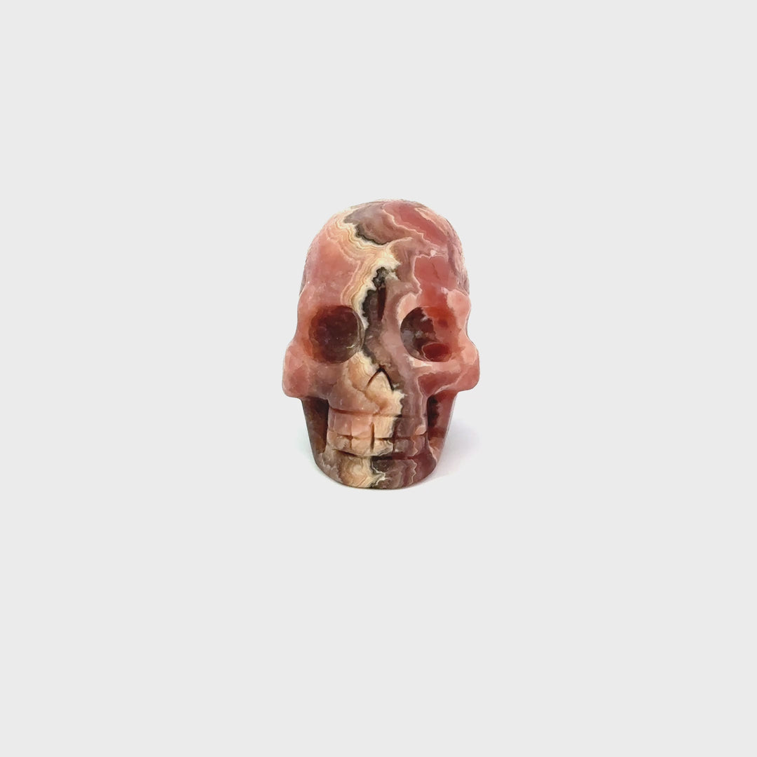 Rhodochrosite Carved Skull Figurine